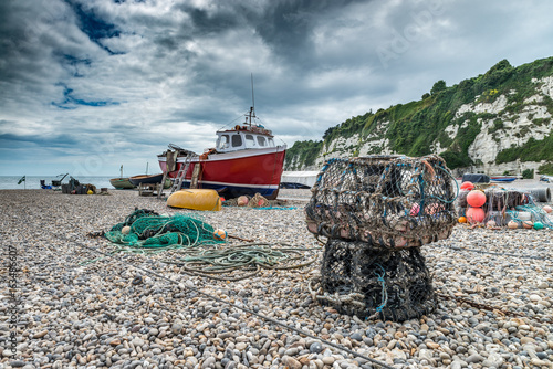 Fishing boat on Beer Beach, Devon, UK