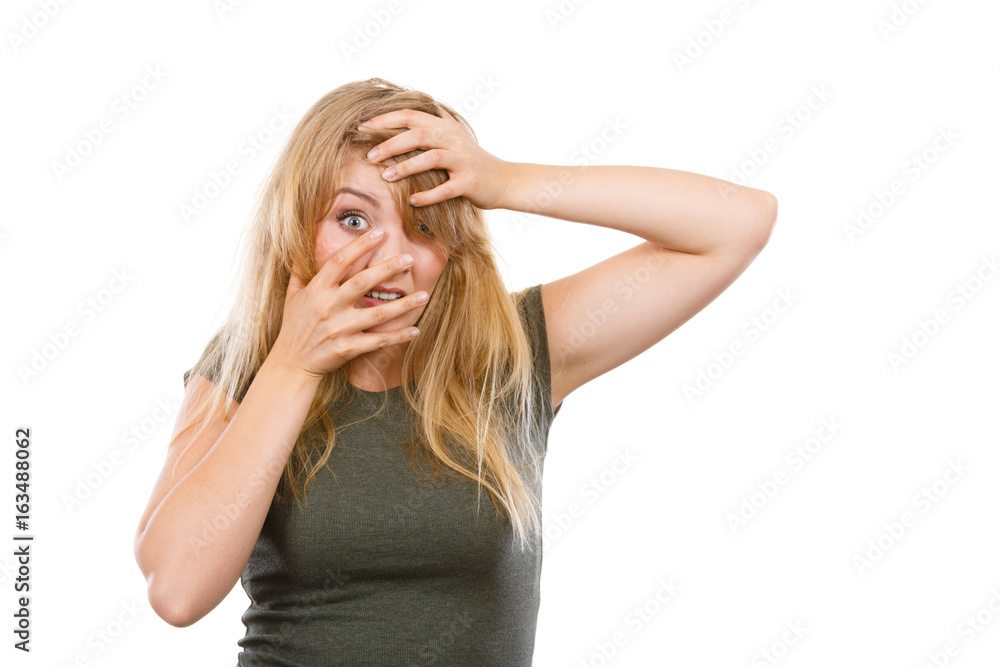 Ashamed embarrassed blonde woman with hands on face Ashamed embarrassed blonde woman with hands on face