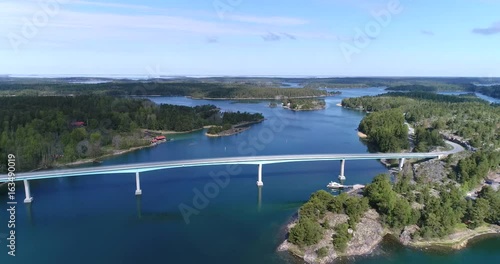 Lovon silta, Cinema 4k aerial landing view of lovo bridge, connecting kemionsaari and kasnas, in the finnish archipelago, in Varsinais-suomi, Finland photo