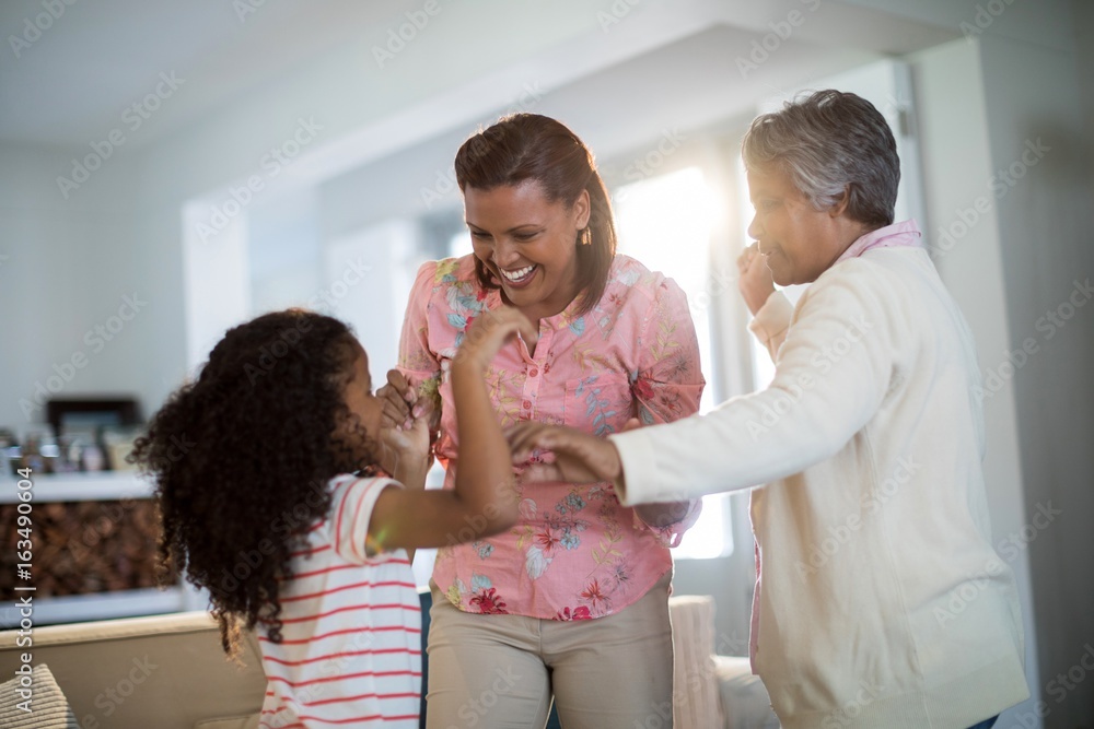 Happy family having fun in living room Happy family having fun in living room