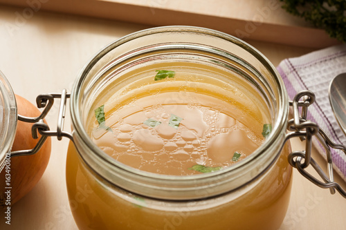 Photography Bone broth made from chicken in a glass jar
