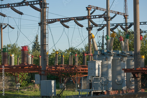 Electrical substation infrastructure with close up on electrical circuit breakers.