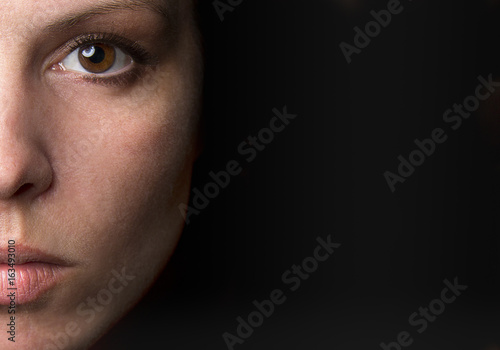 Portrait of a young women with black background