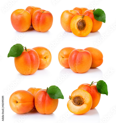 Set of ripe apricot fruits with with green leaf and slice isolated on white