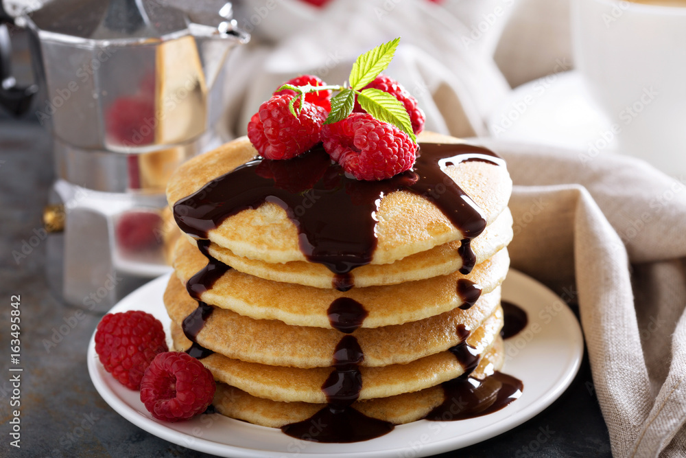 Stack of fluffy buttermilk pancakes with chocolate Stack of fluffy buttermilk pancakes with chocolate