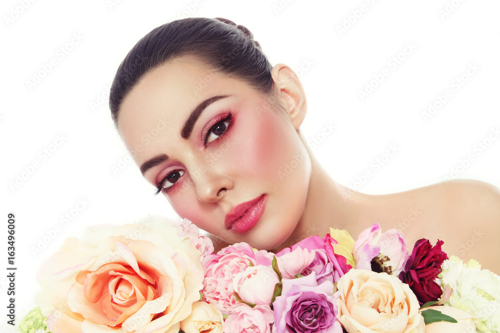 Young beautiful woman with fresh make-up and flowers over white background, copy space Young beautiful woman with fresh make-up and flowers over white background, copy space