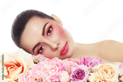 Young beautiful woman with fresh make-up and flowers over white background  copy space