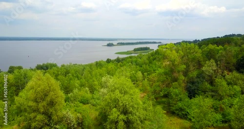 The drone over the trees by the river photo