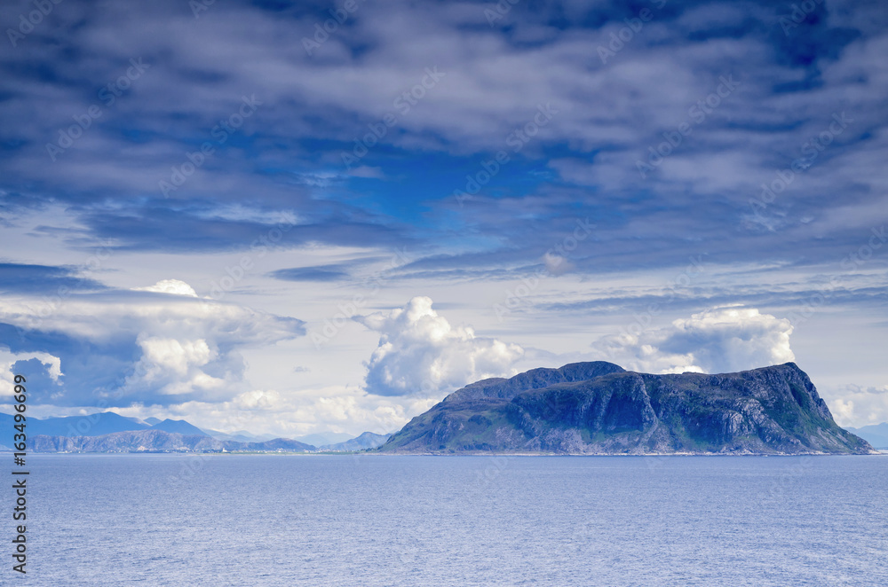 Fototapeta premium Godoy. Godoy is the southernmost and westernmost of the islands in the municipality of Giske, Norway. It is famous for its beautiful nature, dominated by the 497 meter tall mountain Storhornet.