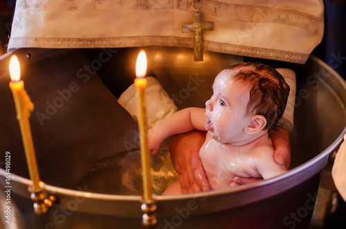 Konstfotografi Baptism of a child in the Orthodox Church