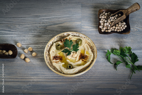 Hummus on a rustic wooden table