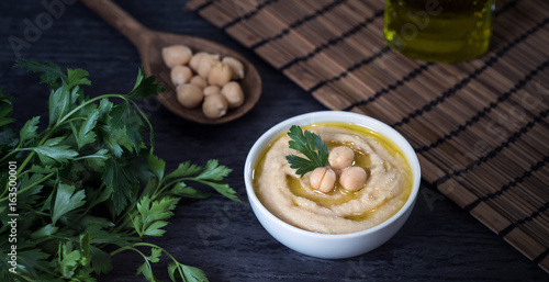 Hummus on a rustic wooden table