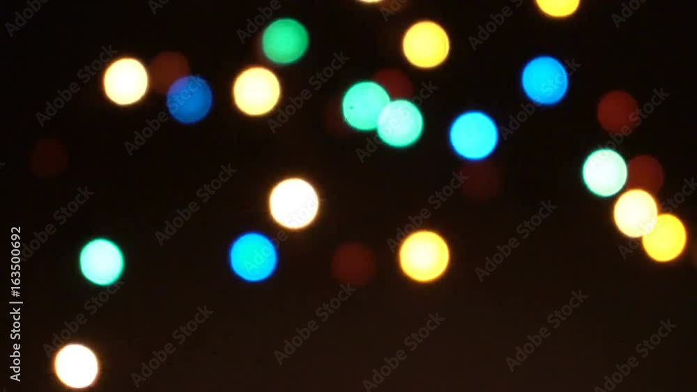 Glare from the garland out of focus. Glare from the garland out of focus.