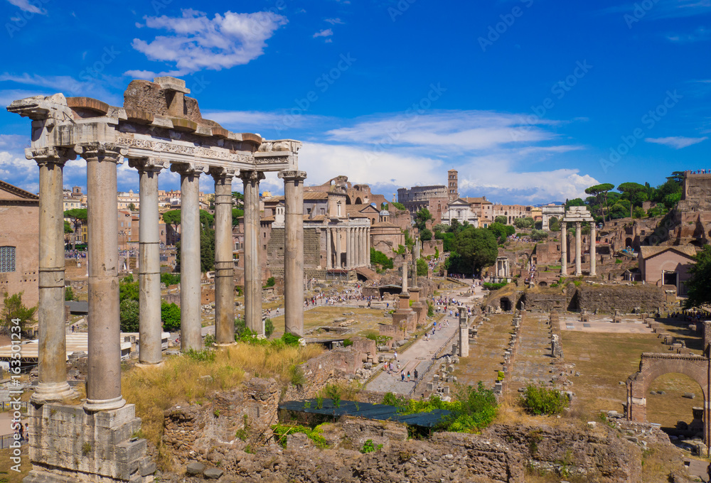 ROME, ITALY - The archeological ruins with Colosseum in historic center of Rome, named Imperial Fora.