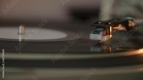 Spinning Turntable, Vinyl Record Player. Audio Needle Is Lowered And Touches Spinning Vinyl Record