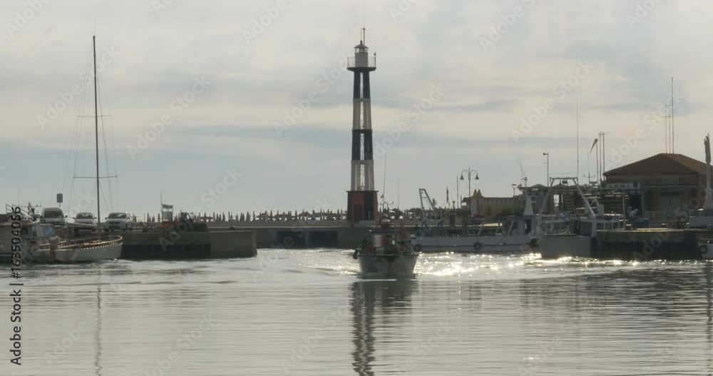 Clams dredge boats entering the port of Cattolica in the Adriatic sea after the clams fishing. June 4th, 2017 - Cattolica (Italy) Clams dredge boats entering the port of Cattolica in the Adriatic sea after the clams fishing. June 4th, 2017 - Cattolica (Italy)