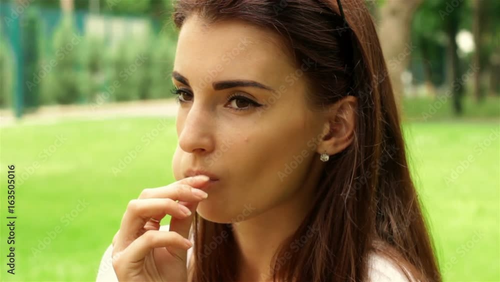 attractive young brunette sucks lollipop attractive young brunette sucks lollipop