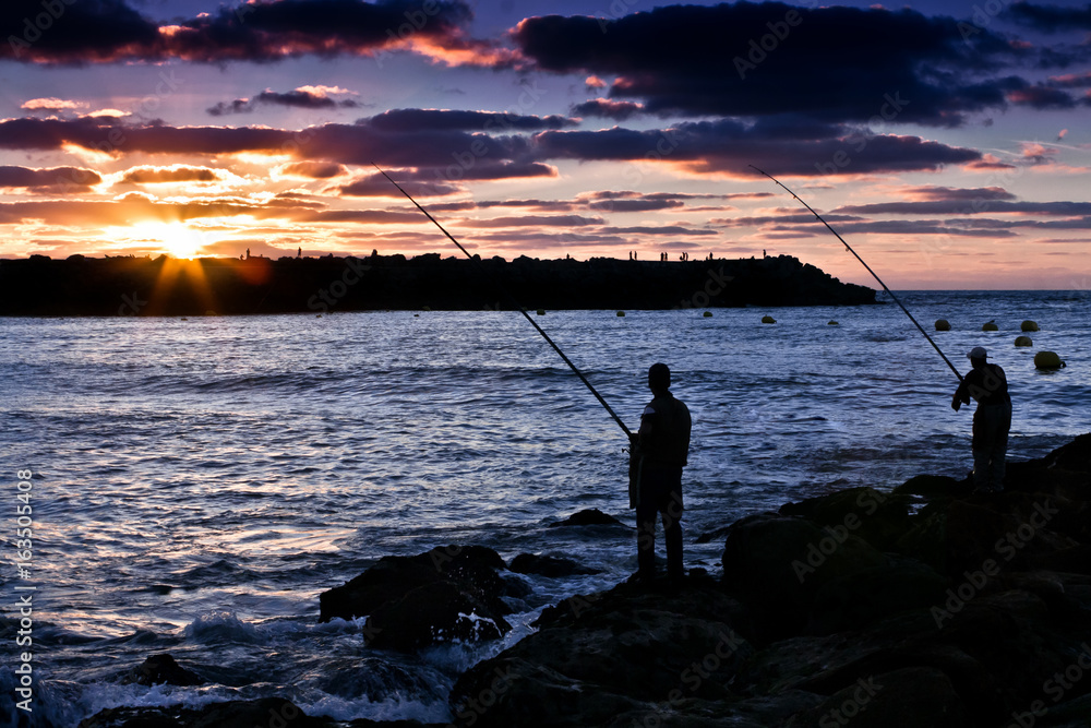 Fishing at the Beach with a Sunset view