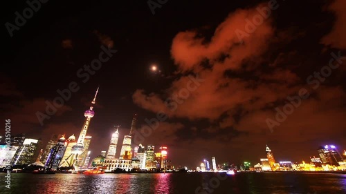 time lapse Shanghai at night,Brightly lit world financial center building. photo