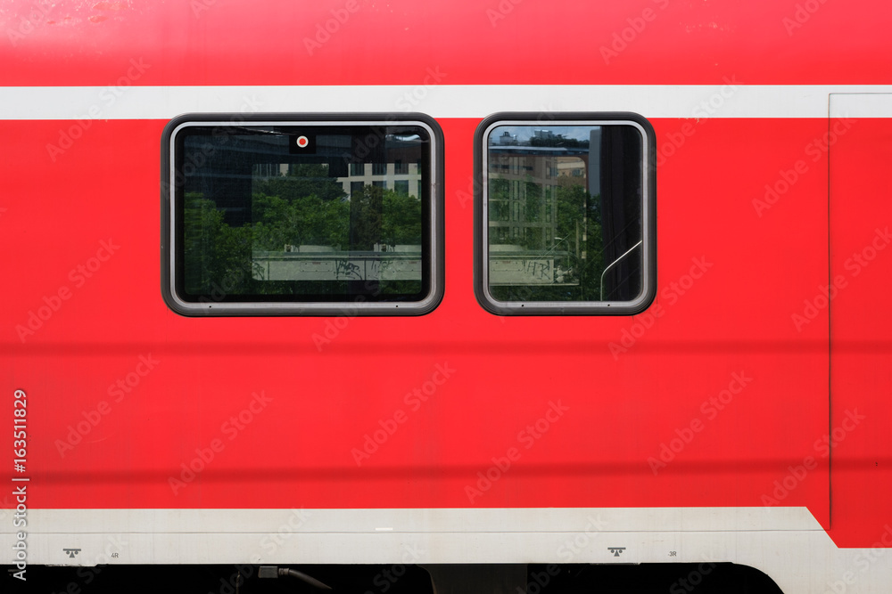 train windows of a red train  from outside