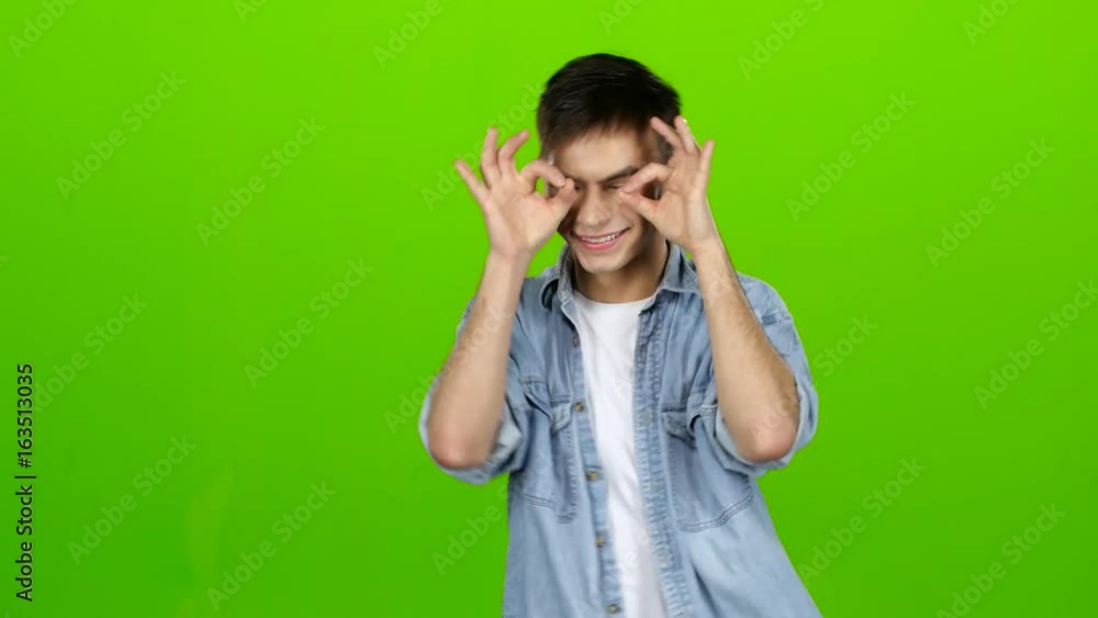 Male actor smiles, showing them different grimaces and language. Green screen Male actor smiles, showing them different grimaces and language. Green screen