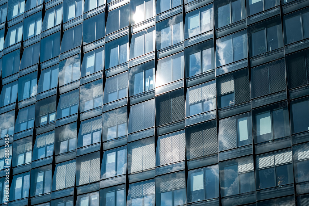 modern building facade , office windows sky reflection