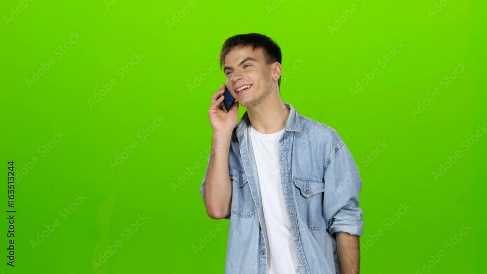 Guy is flirting with his girlfriend on the phone. Green screen Guy is flirting with his girlfriend on the phone. Green screen
