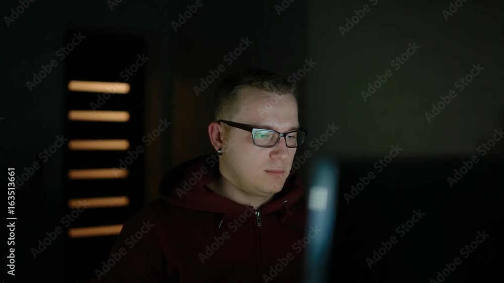 Young man play video game on PC. Guy is very focused , serious and thoughtful. Young man play video game on PC. Guy is very focused , serious and thoughtful.