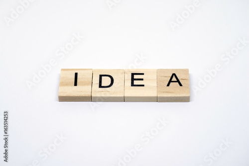 "IDEA" Wooden letters on white background