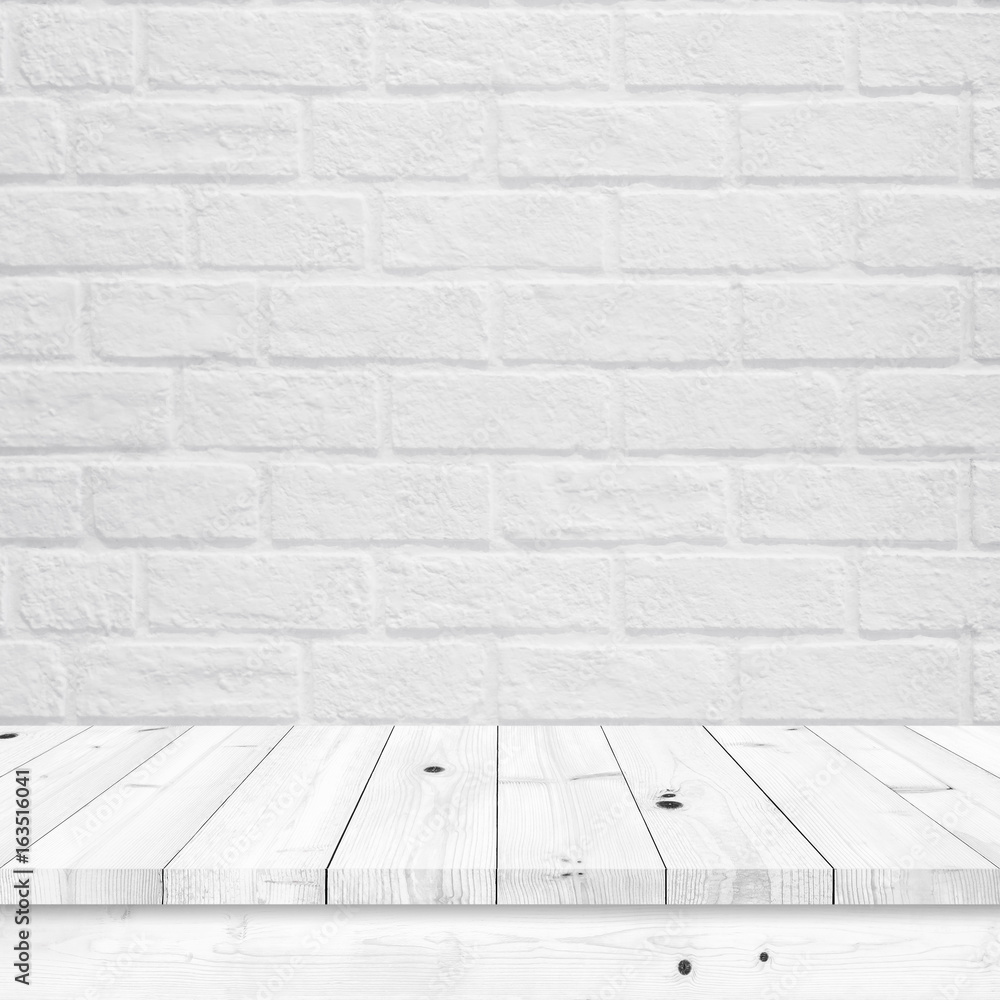 Empty wood table with white brick wall texture.