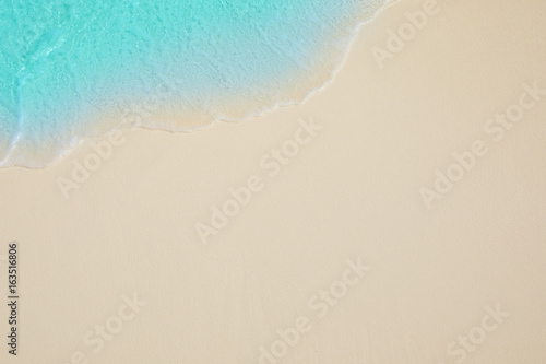 Fototapeta Naklejka Na Ścianę i Meble -  Soft waves of blue sea on the Maldives beach for the background.