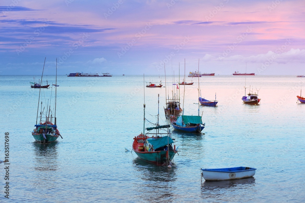 The sea in the evening with many fishing boats