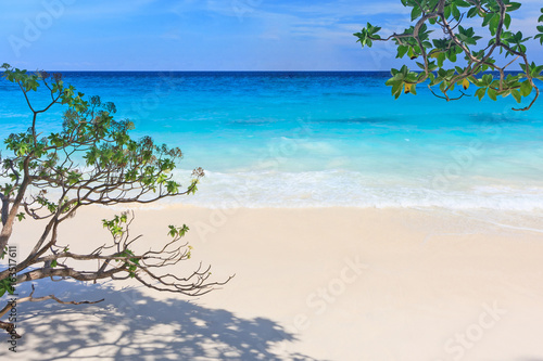 Bright morning with white sand, blue sea, blue sky