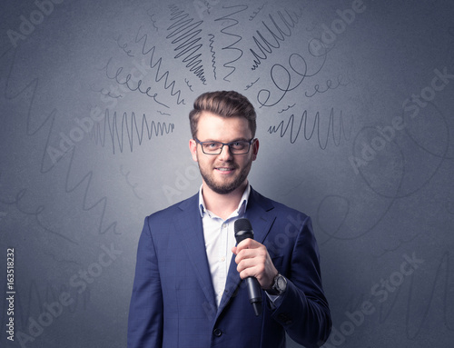 Businessman holding microphone