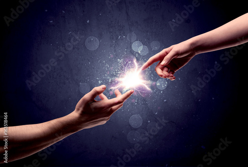 Hands reaching to light a spark