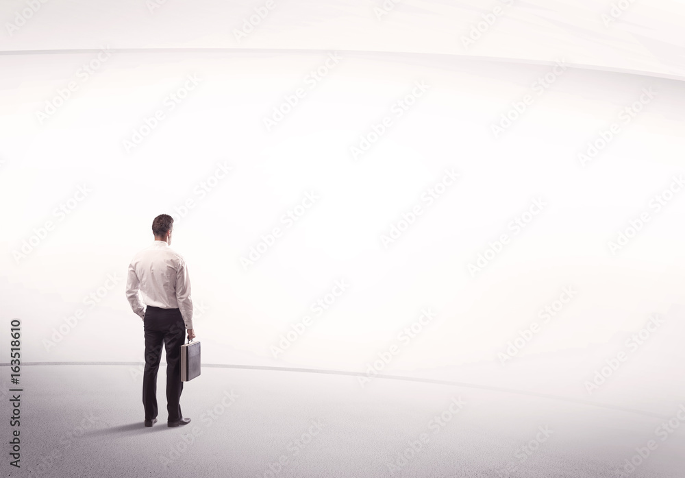 Businessman with briefcase standing still Businessman with briefcase standing still