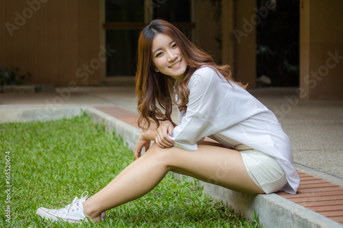 Portrait of thai adult working women white shirt relax and smile photo