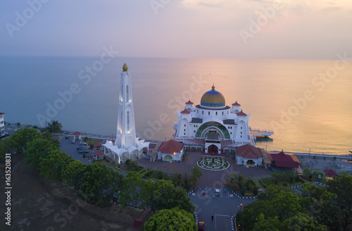 Arial view of Majestic Malacca Straits Mosque during sunset.