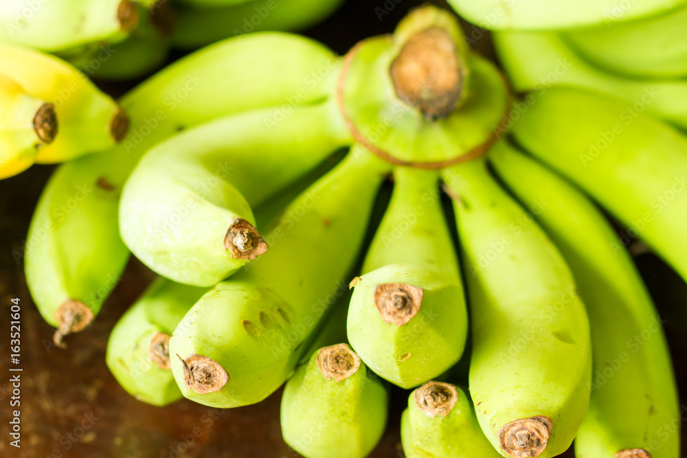 Fresh bananas on wooden background in the fruit market,Healthy food, bananas rich in vitamins, healthy lifestyle and prevention of vitamin deficiency.