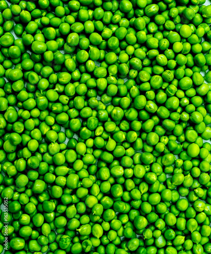 Fresh green peas vegetable texture background, top view, free space
