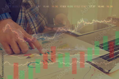 Double exposure business man using technology stock financial indices on currency exchange