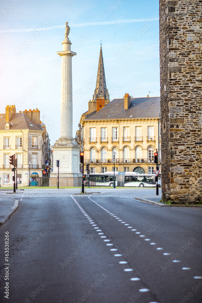 Street view on the Marechal-Foch sqaure with Louis column during the sunset in Nantes city in France