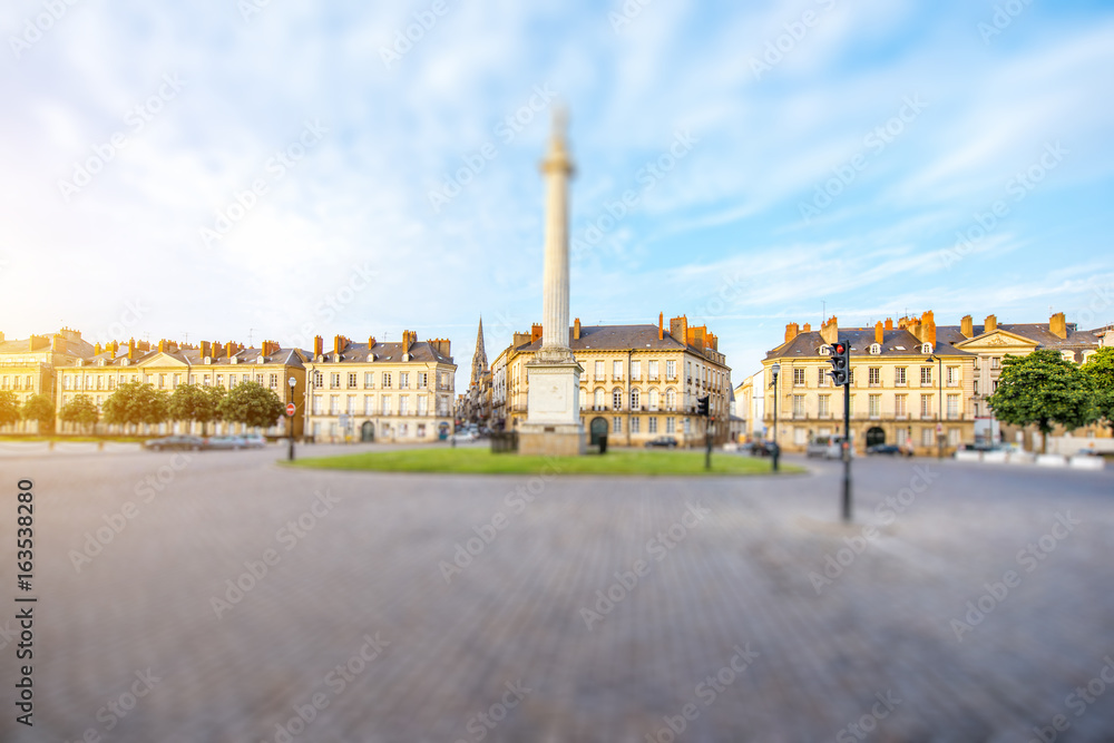 Street view on the Marechal-Foch sqaure with Louis column during the sunset in Nantes city in France