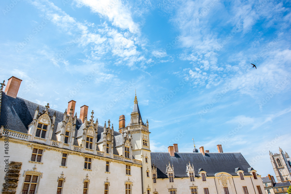 View on the castle of Dukes of Brittany with blue sky during the sunny weather in Nantes city in France