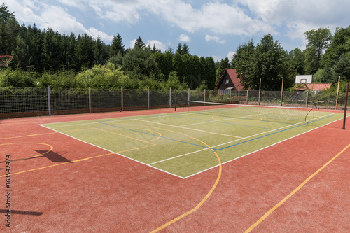 Outdoor playground for tennis, volleyball and football.