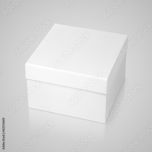 Closed white paper square box on gray background with clipping path
