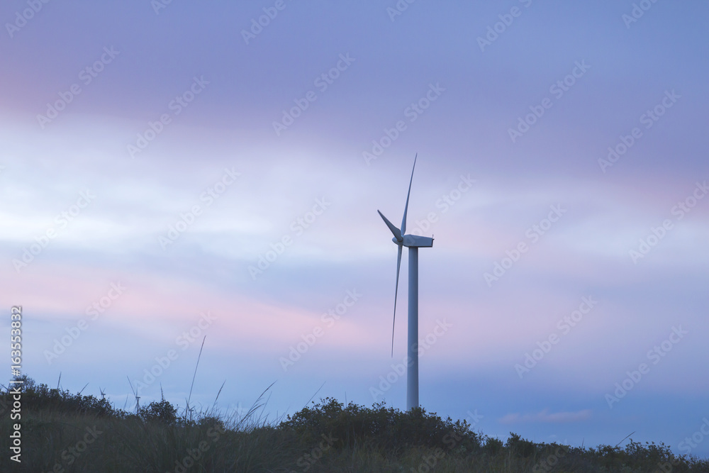two wind turbines generating clean renewable eolic energy in a stormy day two wind turbines generating clean renewable eolic energy in a stormy day