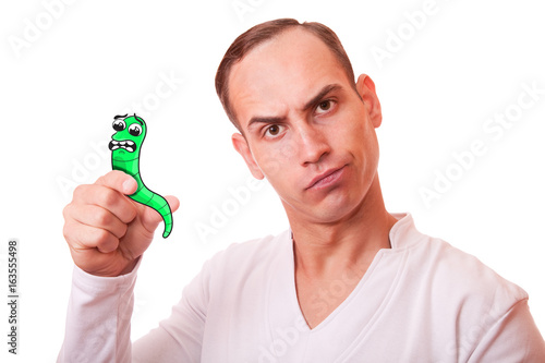 portrait of a young man in white background c cartoon scared worm in the hand