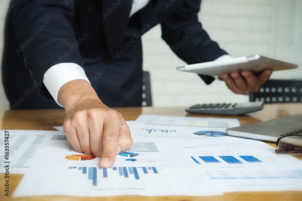 Business man meeting with digital tablet computer analyze financial graph in the conference.Business meeting time working with new startup project.presentation concept, Accounting analyze plans. Business man meeting with digital tablet computer analyze financial graph in the conference.Business meeting time working with new startup project.presentation concept, Accounting analyze plans.