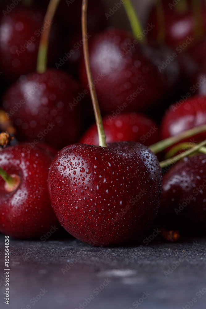 Juicy red cherry on a dark background. Juicy red cherry on a dark background.
